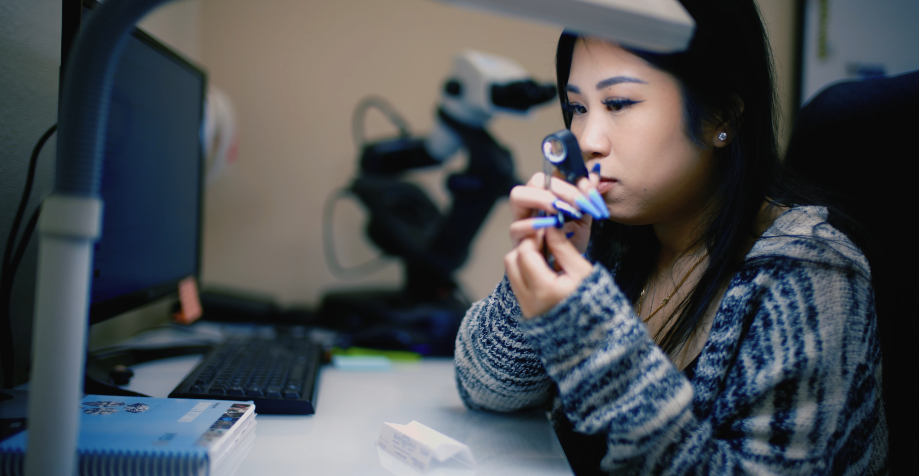 GIA gemologist reviewing jewelry